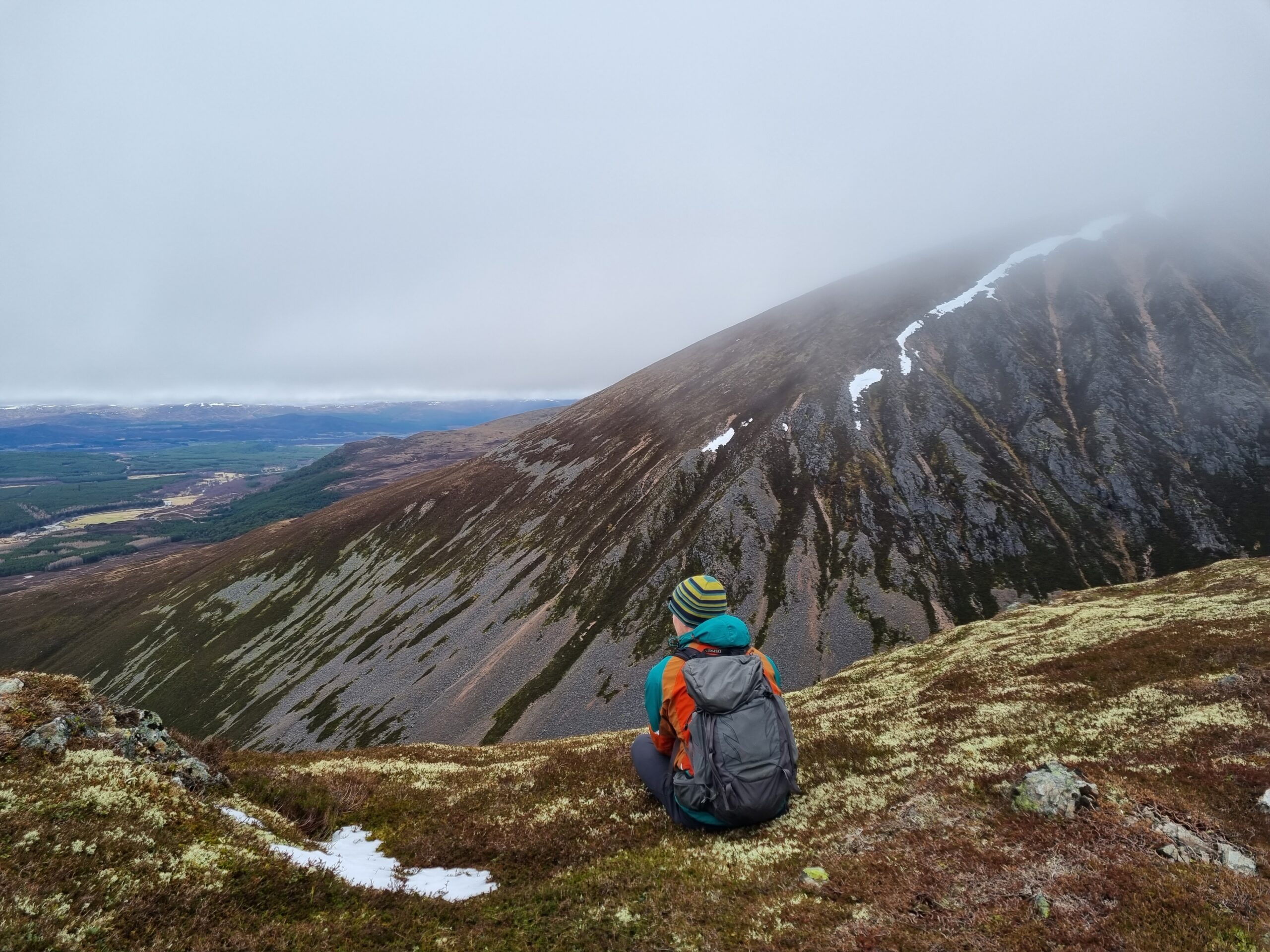 Man looking out over the corrie Coire Garbhlach, Cairngorms