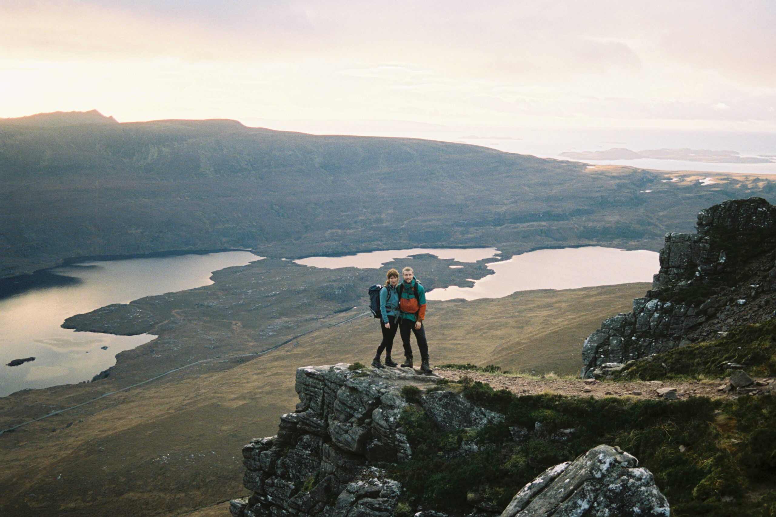 A couple standing on the saddle of Stac Pollaidh, Assynt