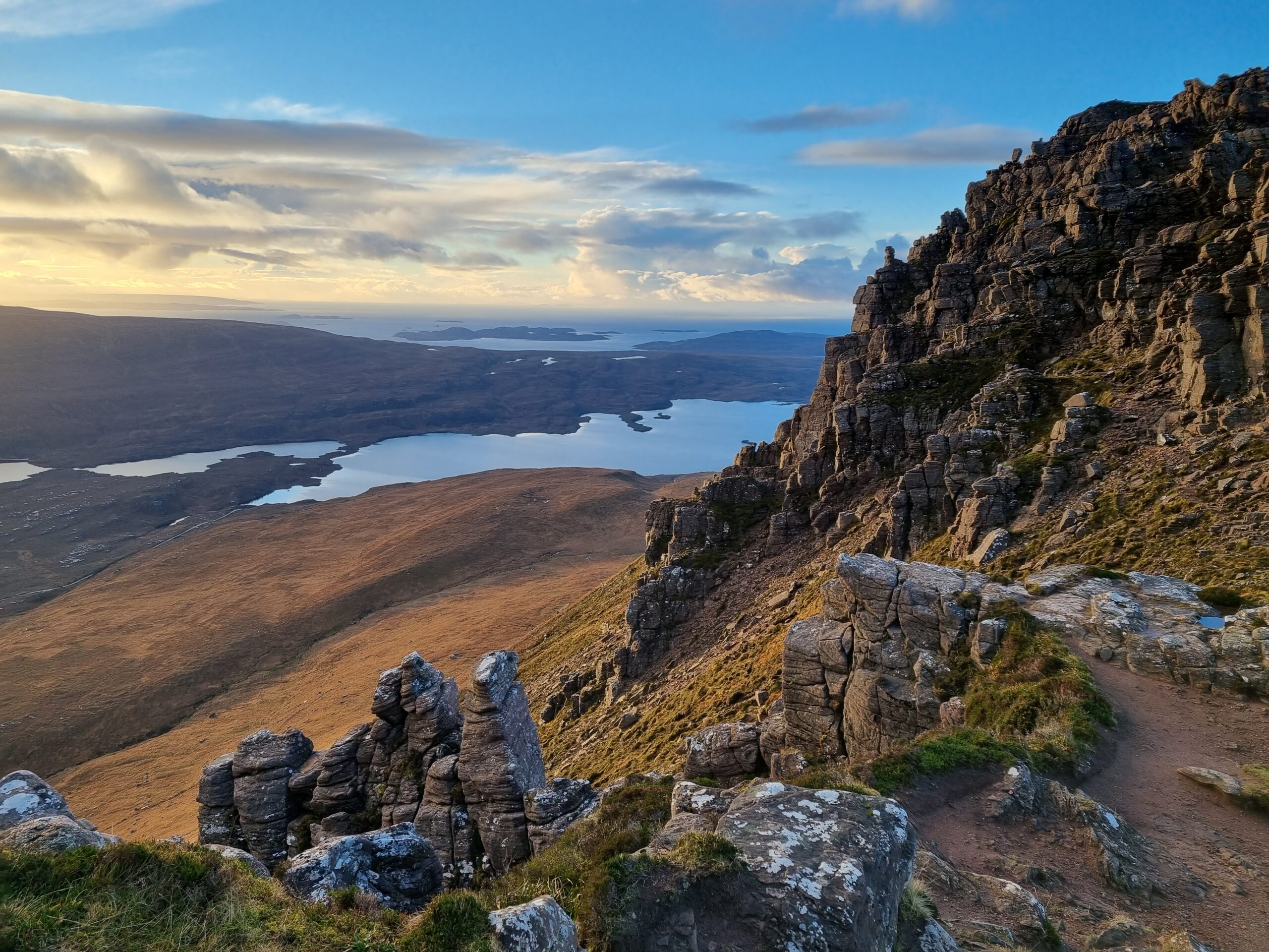 The western ridge of Stac Pollaidh, Summer Isles in the distance