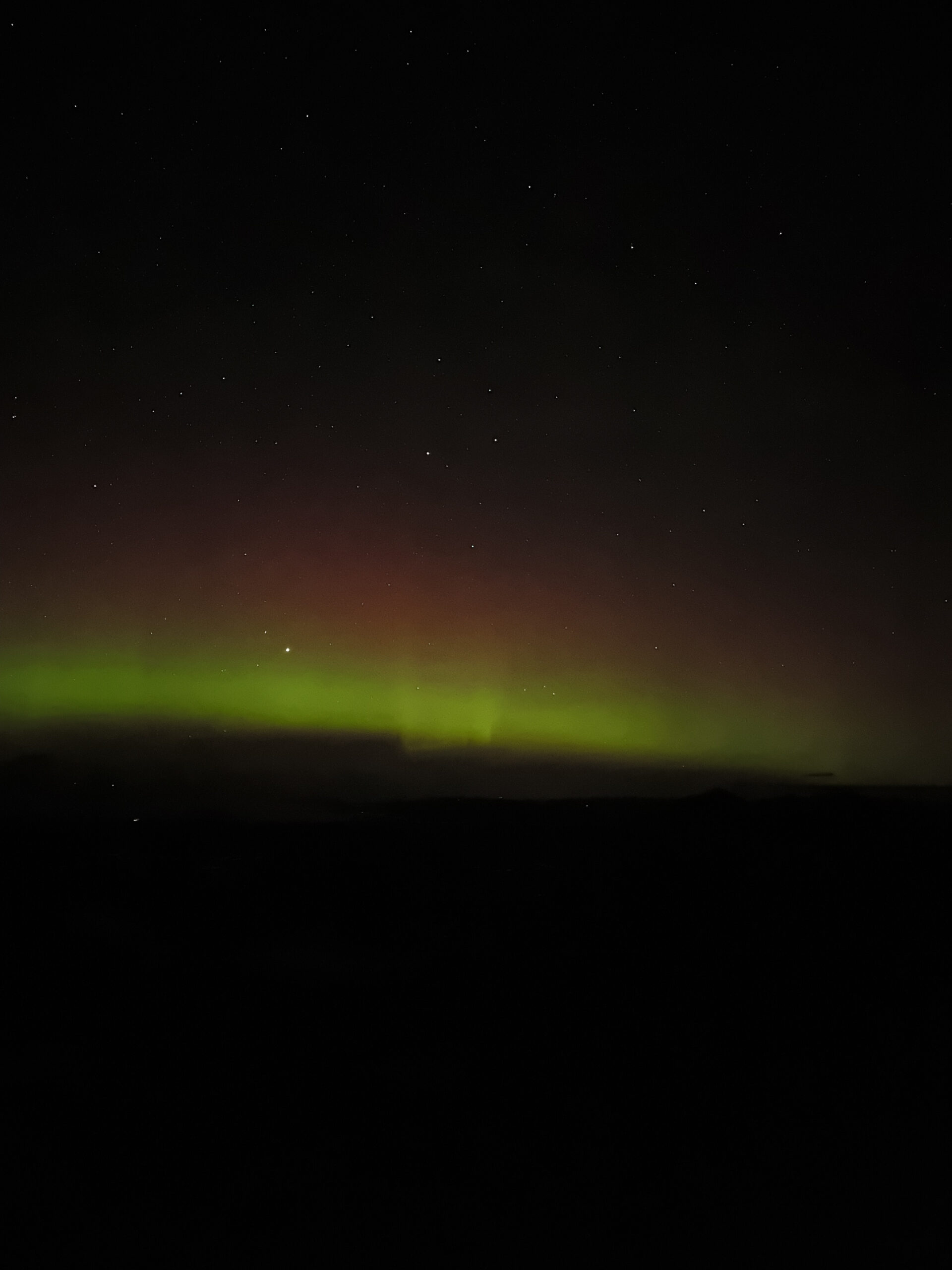 Aurora borealis dancing through the sky from Suilven, Scotland