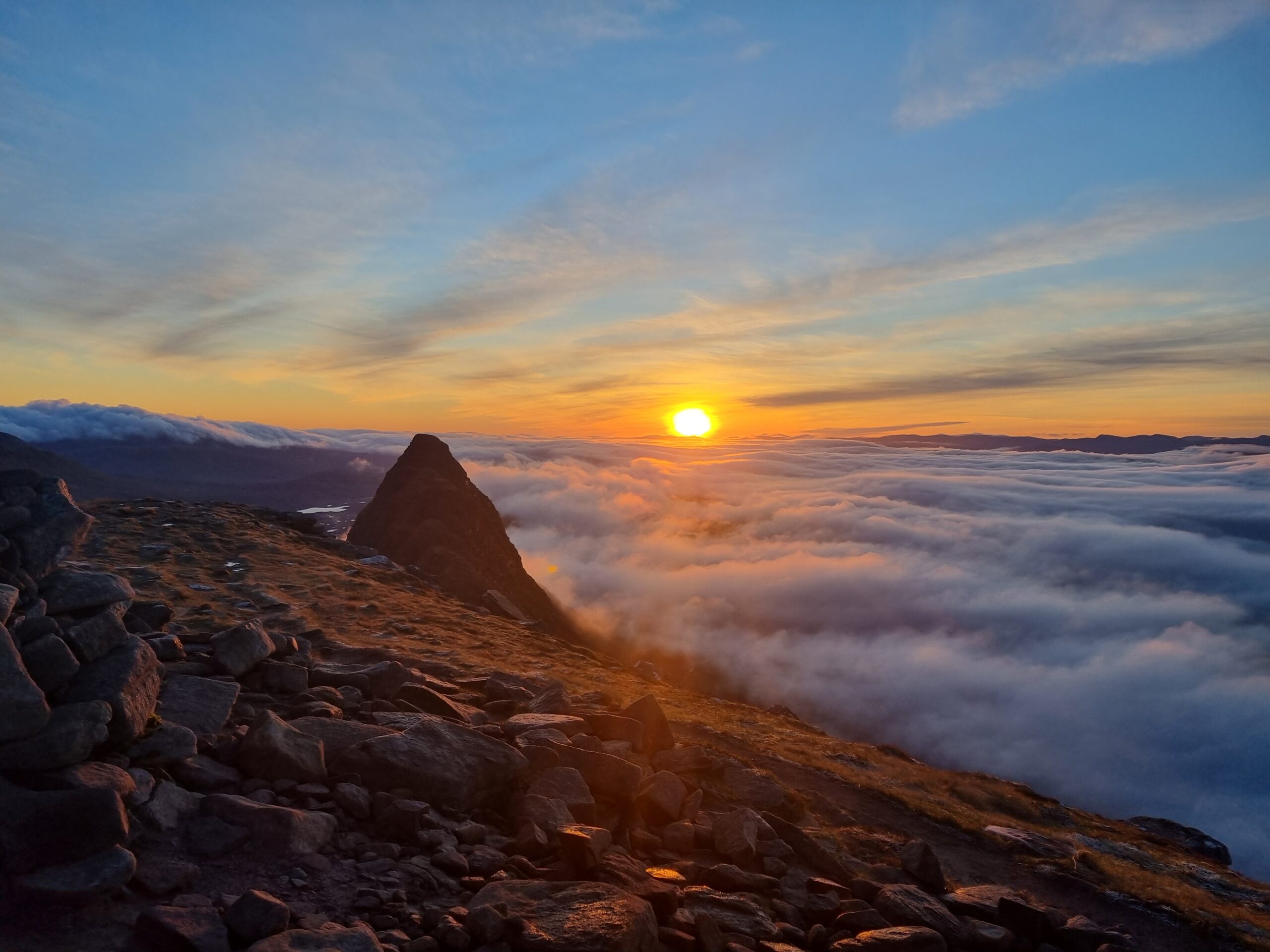 Sunrise and cloud inversion from Suilven, looking out over Meall Meadhonach