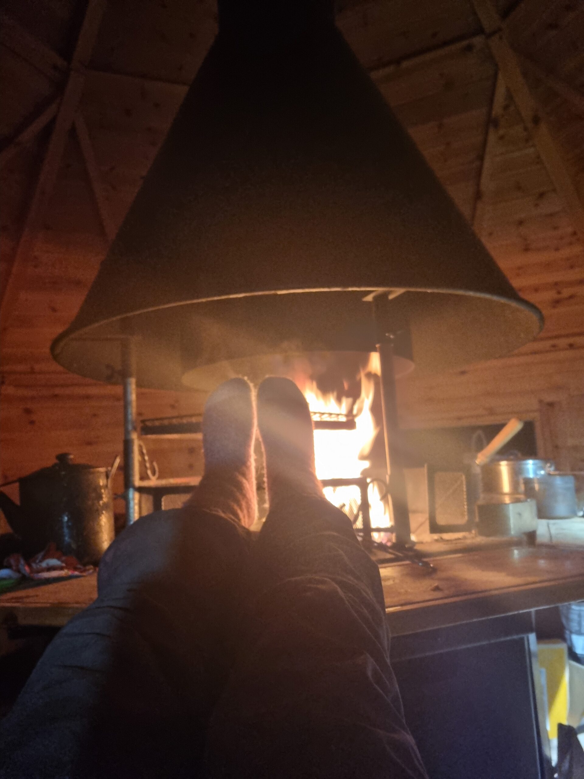 By the fire in the Harbour BBQ Hut on the Isle of Rùm, Scotland