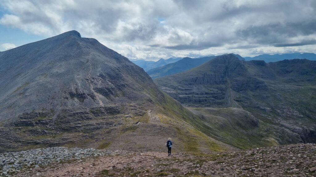 A hike approaching Mullach Coire Mhic Fhearchair in the Fisherfield Forest, Scottish Highlands