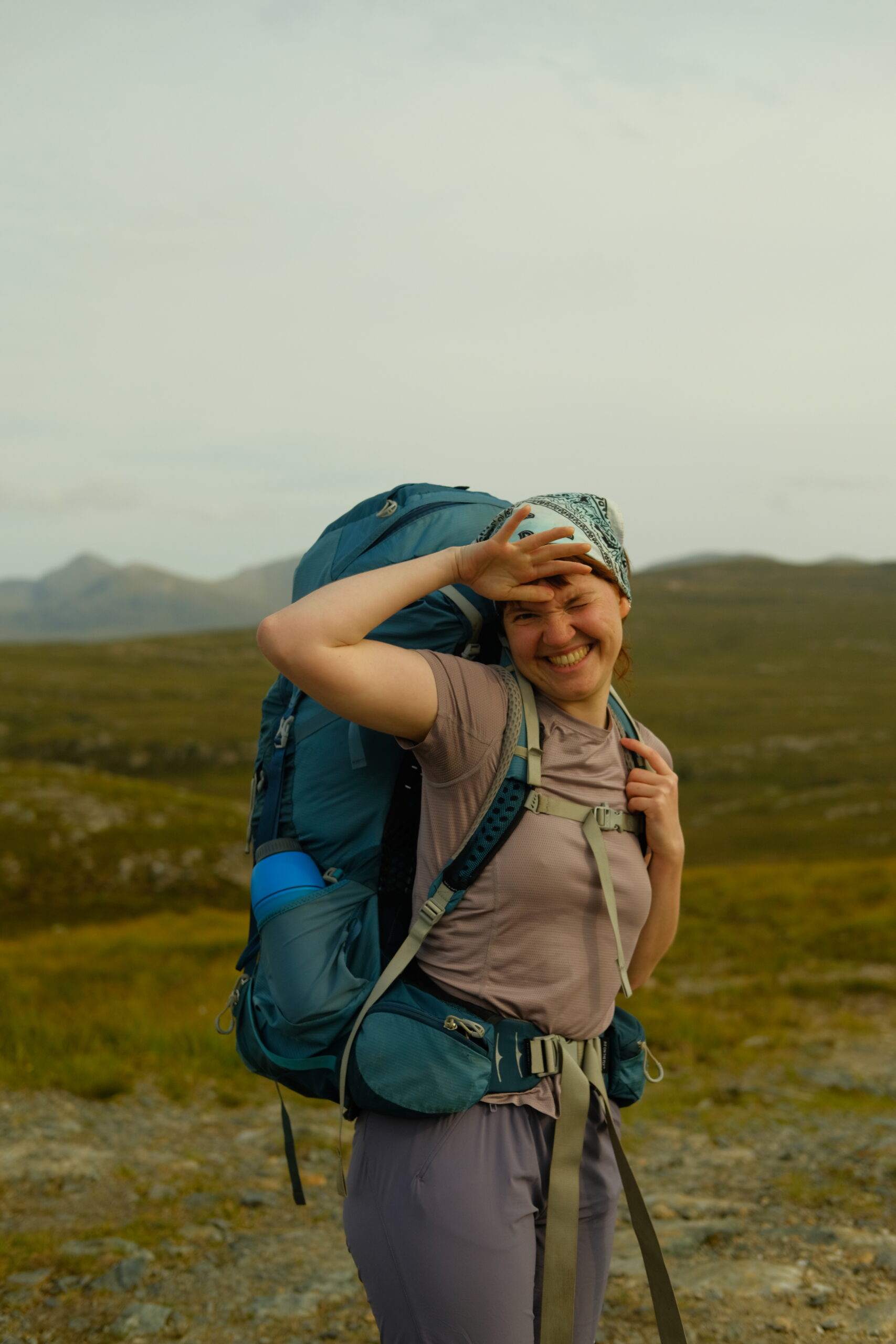 Hiker with rugsack in valley, Fisherfield Forest, Scottish Highlands