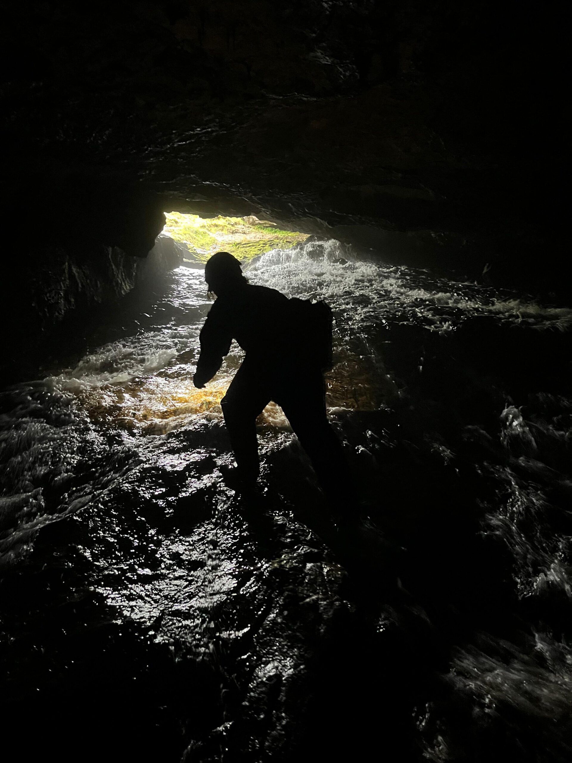 A caver in Uamh nan Uisge or the Waterslide, Cnoc nan Uamh, Scotland