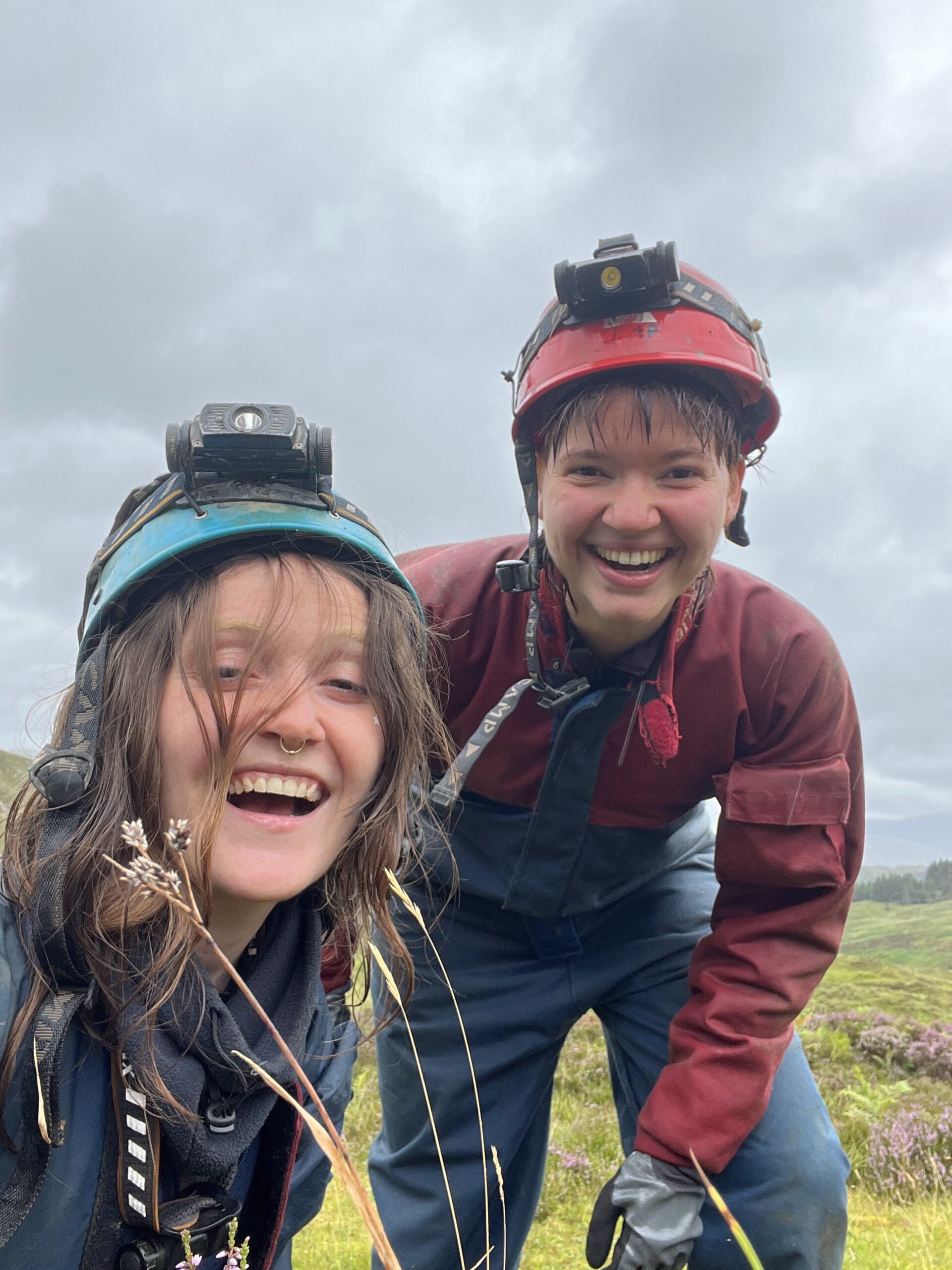 Two cavers in Traligill glen, Assynt