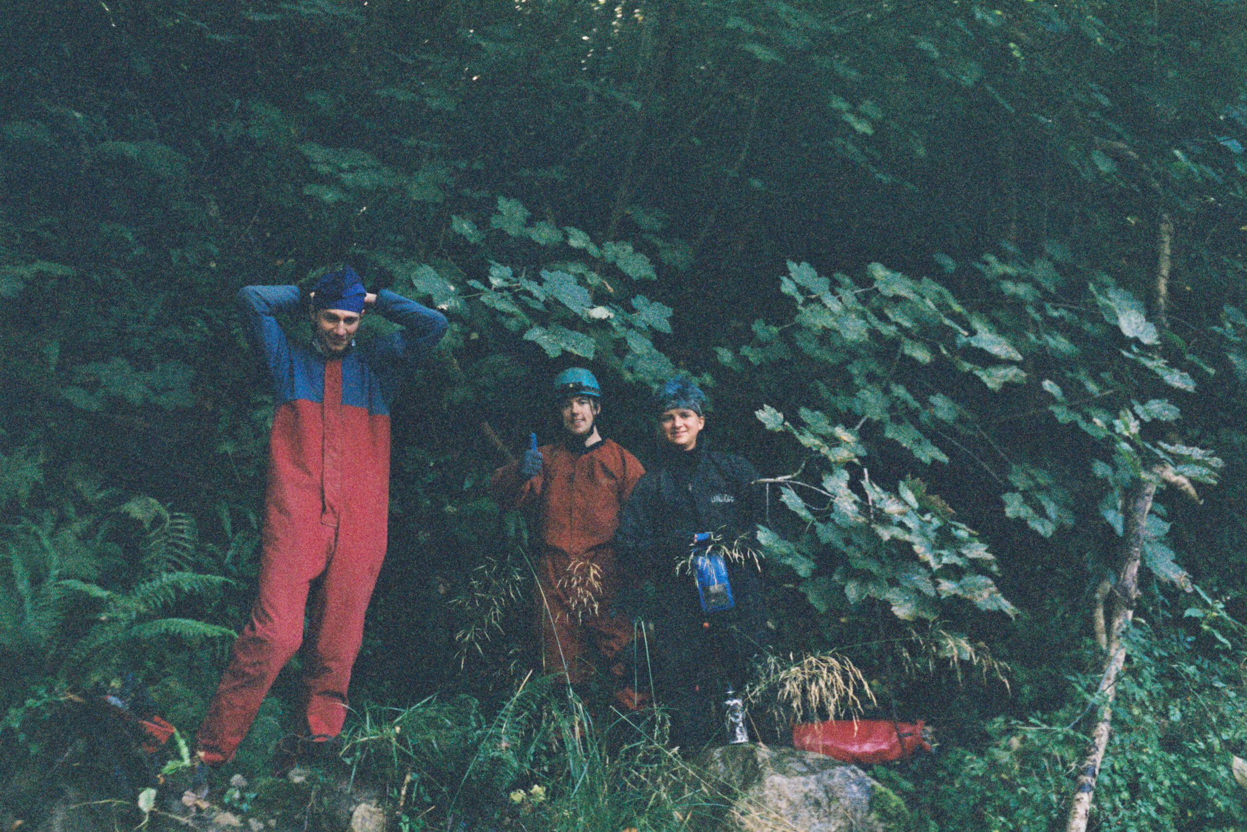 Three cavers in front of Ogof Hesp Alyn in North Wales